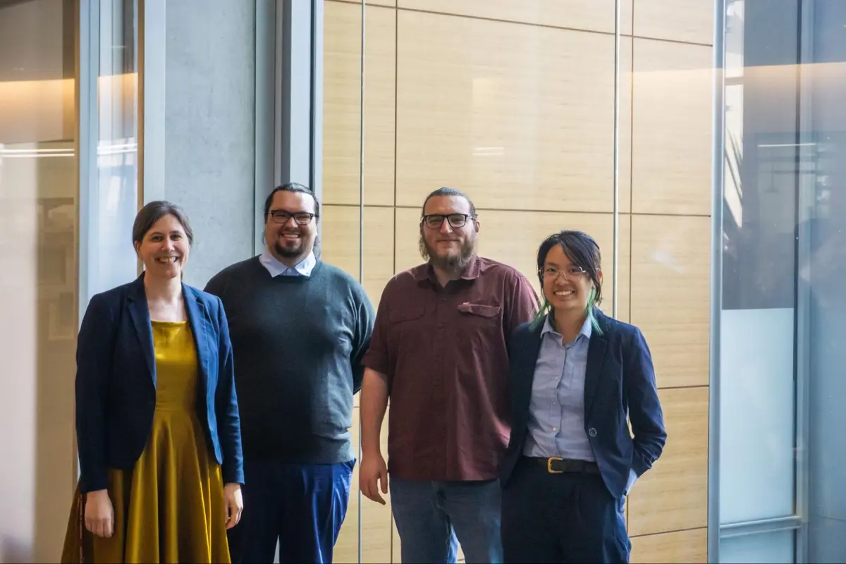 Christina, Danny, Andrew and Amber, CHTC's facilitation team, standing together smiling
